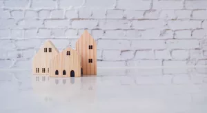 Wooden houses against a white background.